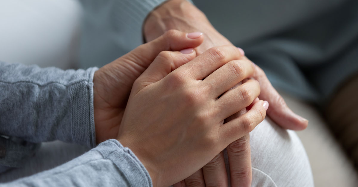 A supporter holding a victim's hold.