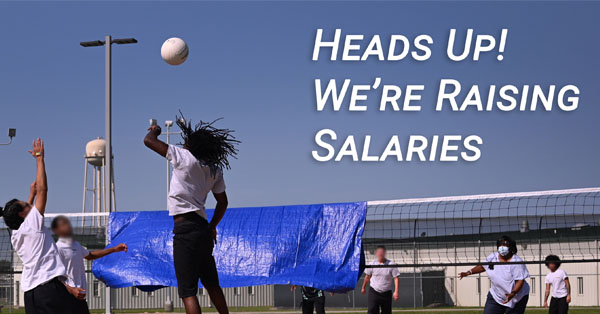 An image of youth playing volleyball with a headline stating "Heads Up! We're Raising Salaries".