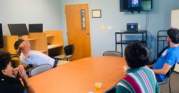 Photo of youth watching the online training about working as a barber.