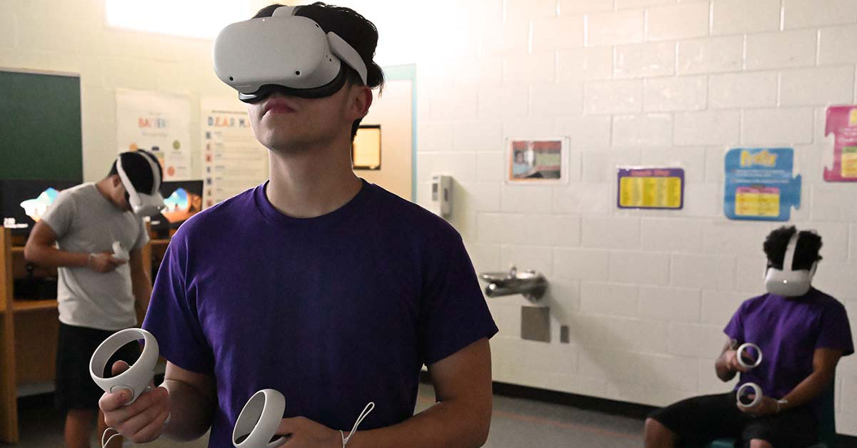 Youth learn about auto repair by virtual reality at Evins.