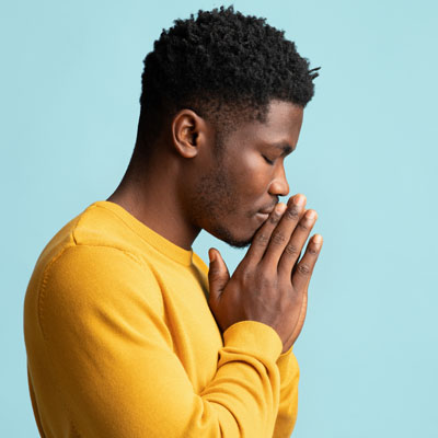 A man with closed eyes deep in thought.