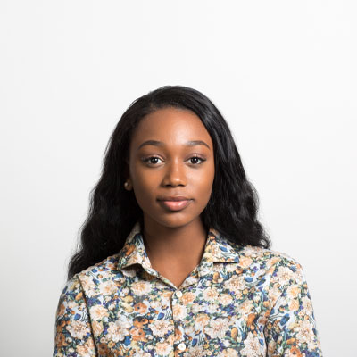 A woman half-smiling.