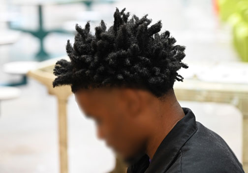 Mart youth preparing for a haircut.