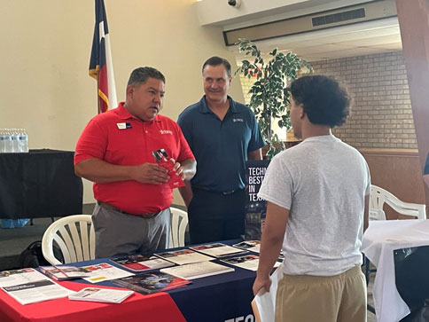 Job recruiters discuss potential careers with youths.