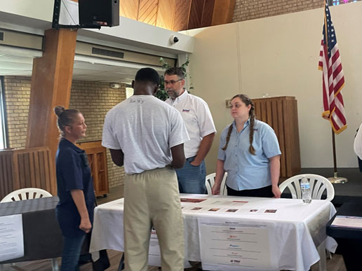 Job recruiters answering questions from the youths.