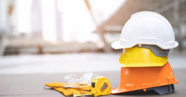Photo of construction tools and hardhats.