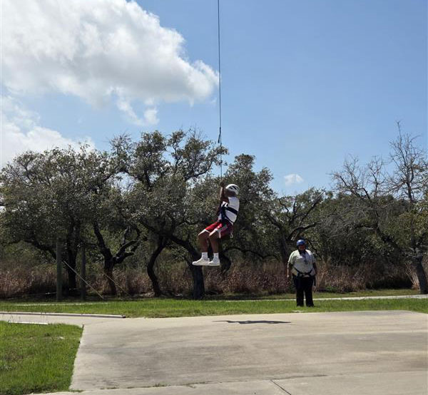 A youth on the “Screamer” giant swing.