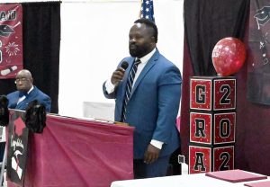 Michael McKenzie, Principal at Mart, speaks to the graduates.